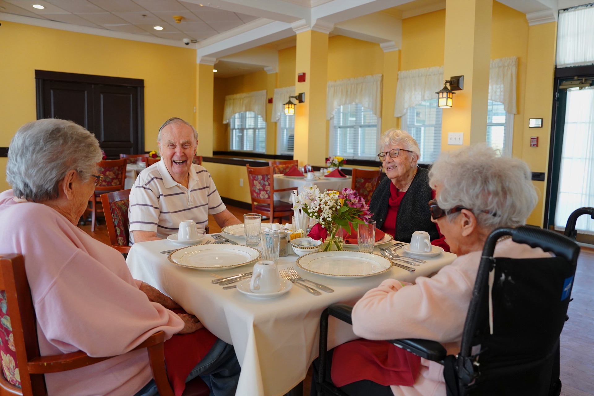 Residents enjoying lunch together in the Swampscott dining room