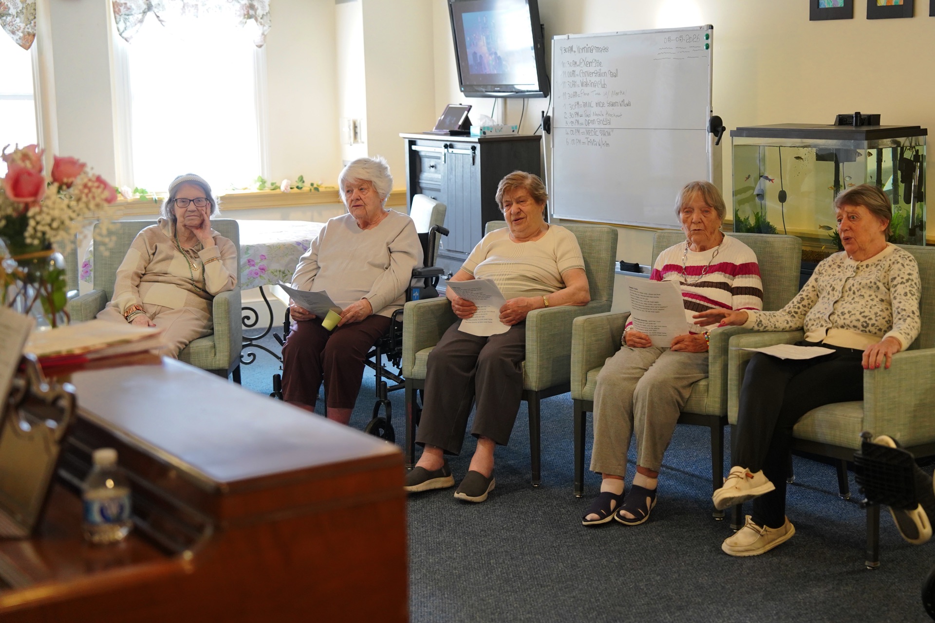 Residents enjoying a group sing-along activity at John Bertram House
