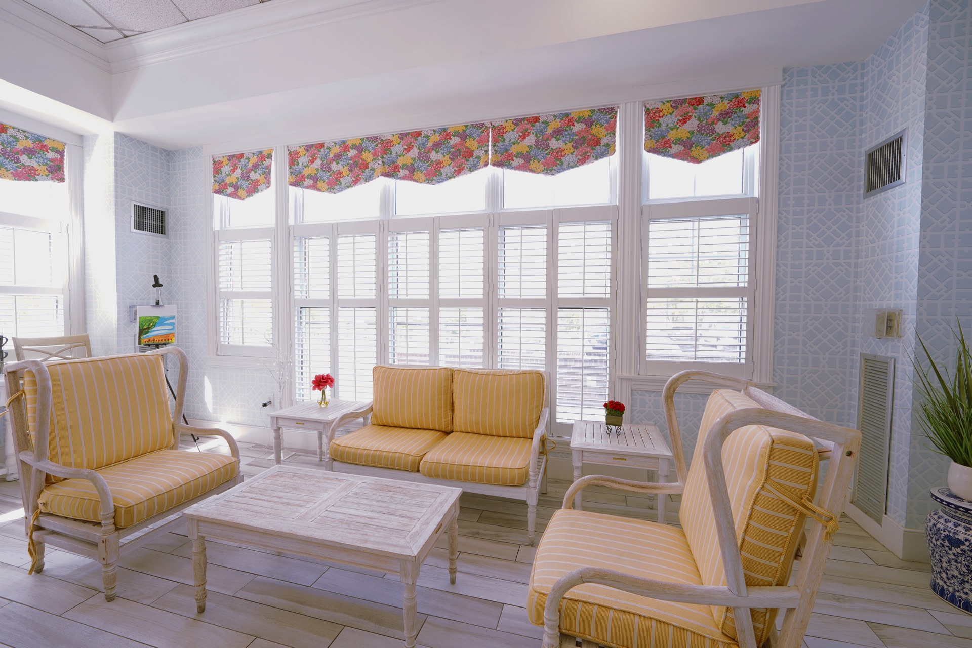Bright sunroom gathering space at John Bertram House of Swampscott